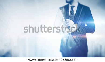 Double exposure of city and business man with light effects