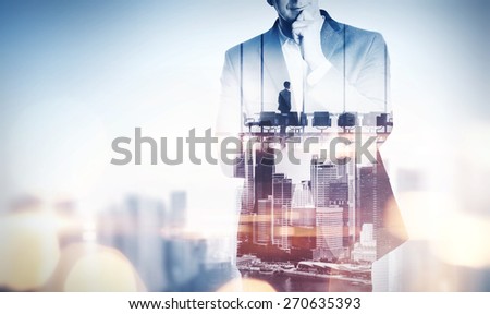 Double exposure concept with thinking businessman and city. With special lighting effects