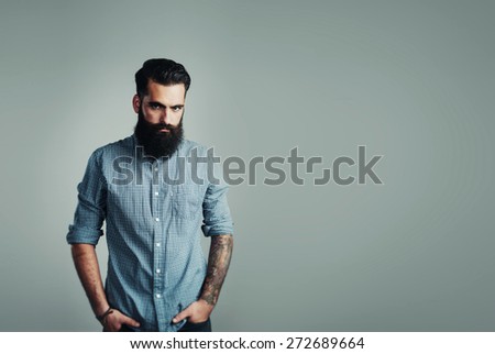 bearded man on light blue background