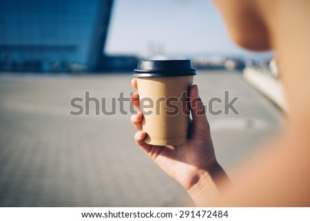 mock up of cup a coffee in the city