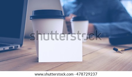 White Business Card Mockup Wood Table Take Away Coffee Cup.Adult Businessman Work Modern Notebook Office Blurred Background.Clean Empty Object Ready Private Corporate Information.Horizontal Mock Up