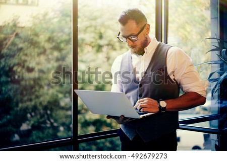 Similar – Image, Stock Photo Serious young stylish guy standing near shabby wall on street