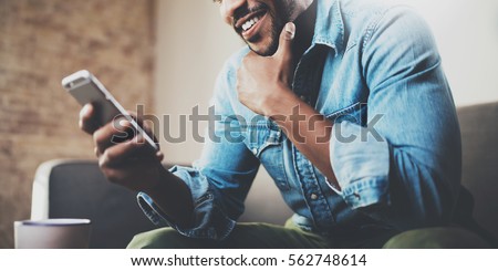 Similar – Image, Stock Photo Focused man using smartphone on rooftop