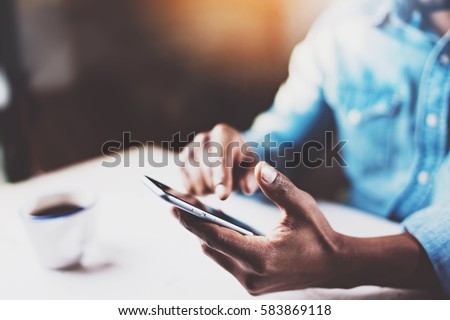 Similar – Image, Stock Photo Focused man using smartphone on rooftop