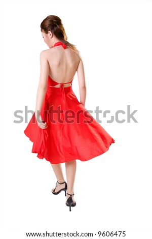 woman in red dress turn around while walking
