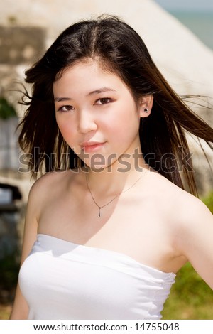 beautiful young woman wind blowing her hair