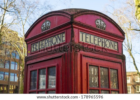 Close up of old red telephone booth in London, UK