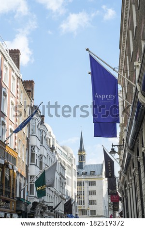 LONDON, UK - MARCH 01: Row of of banners for famous and expensive shops in New Bond Street. March 01, 2014 in London.