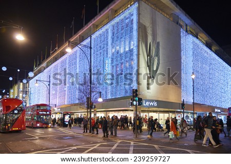 LONDON, UK - DECEMBER 20: Nighttime shot of John Lewis department store exterior in busy Oxford  street with wall of lights as part of its Christmas decorations. December 20, 2014 in London.