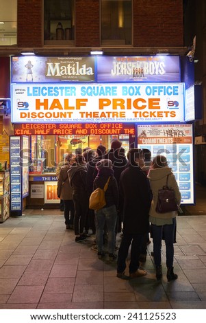 LONDON, UK - JANUARY 02: People lined up for discounted theatre tickets at night in Leicester Square. January 02, 2015 in London.