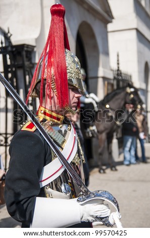 LONDON, UK - APRIL 02: Portrait of Royal Horse Guards in typical outfit. April 02, 2012 in London. The horseguard troopers carry out ceremonial duties and are the queens escort during state visits.