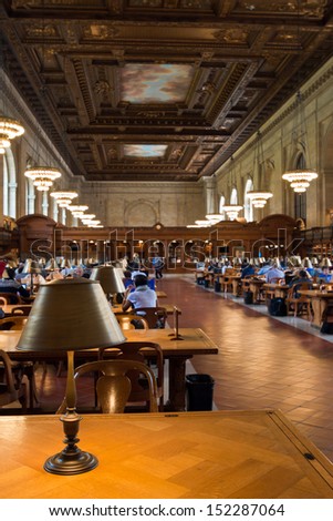 NEW YORK CITY - MAY 5: New York Public Library, the third largest public library in North America. Detail of desks and lamps on the Rose main reading room. May 5th, 2013 in Manhattan, New York City.