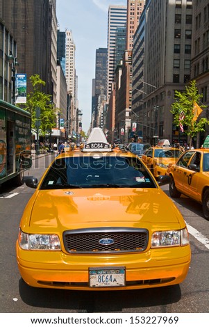 NEW YORK, USA - MAY 7: Taxis in the traffic of 5th Avenue, Manhattan, May 7th, 2013 in New York City. Fifth Avenue has the world\'s most expensive retail spaces as the symbol of wealthy New York.