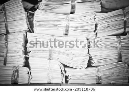 Piles of paper on the shelves