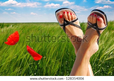 ecological feet crossed with two poppies