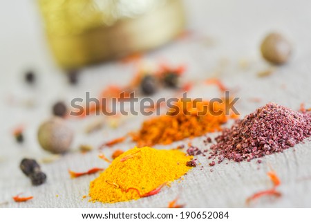 Closeup of various colorful spices, powders and herbs