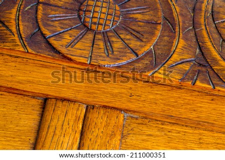closeup symbols engraving on luxurious wood cabinet