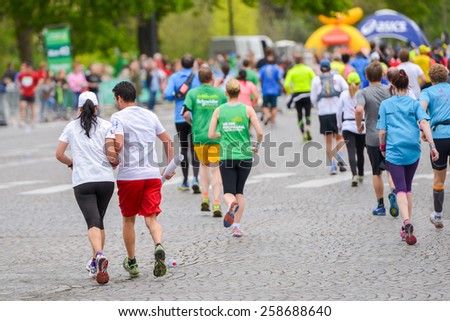 PARIS, FRANCE - APRIL  06 : marathon runners finishing line at Paris International Marathon on April 06, 2014 in Paris, France