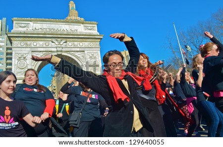 NEW YORK, NY - FEB 14: One man joined nearly 300 women in a One Billion Rising flash mob in Washington Square Park in New York City, NY on February 14, 2013 to protest violence against women.