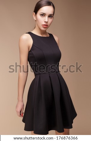 Fashion photo of young magnificent woman in different dress set. Studio photo