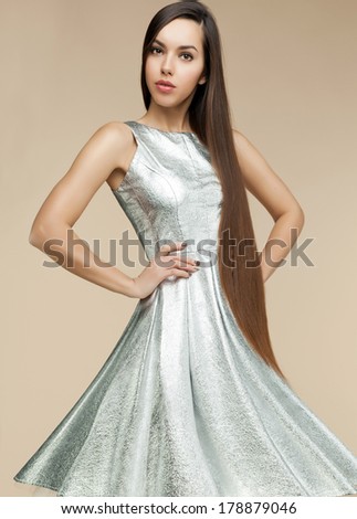 Fashion woman in silver dress.More outfits in set