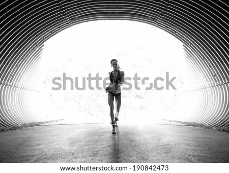 Runner athlete feet running on urban road. woman fitness silhouette  jog workout wellness concept