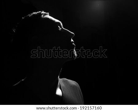 Awe. Male head profile silhouette. Dramatic theater performance