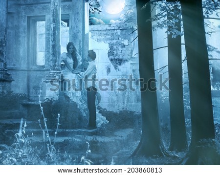 Appointment.Fairy tale story.Two lovers in hidden place under moonlight.Toned image