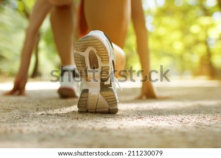 Athlete runner feet running on treadmill closeup on shoe.Female fitness with open space around