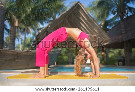 Similar – Foto Bild urdhva dhanurasana.foto des Mädchens beim Yoga am Pool in einem Ferienort