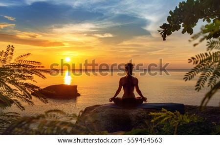 serenity and yoga practicing at sunset,meditation 商業照片 © 