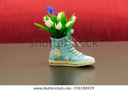 small shoe design as a vase of flowers