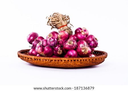 Group of String Fresh Red Onion Unpeeled with Woven Basket kitchenware harvest from farm garden Isolated on white background.