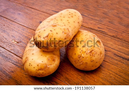 Group of Fresh Potato on Wood Table , Country Rustic Style.