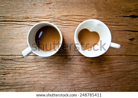 Valentine Day Concept and Idea. Coffee Mug in Design of Heart Shape and Round Shape Together Couple Cup, Love and romantic idea on Wood Table Background, Food Rustic Still Life Style.
