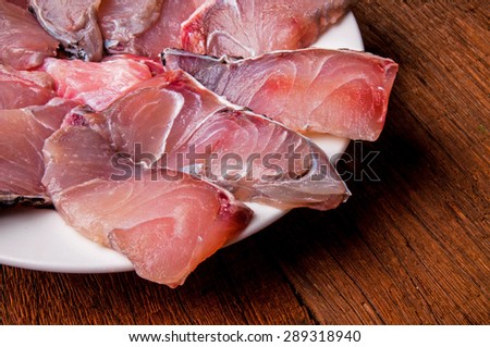 Barramundi, Silver Perch, White Perch, Sea Bass. Fresh Ocean Fish Sliced. Cooking Idea. / on Wood Table Background, Rustic Still Life Style. Close up Selective Focus Shot.