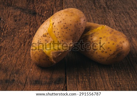 Fresh Hot Boiled Potato (Pair, Two) Unpeeled Skins Textured on Wood Table Background, Concept and Idea of Food Cook Rustic Still life Style.