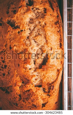 Banana Bread Loaf, Homemade Fresh Baked from Oven in Square Tin Pan and Cooking Rack, Concept and Idea of Breakfast, Bakery. Close up Vertical.