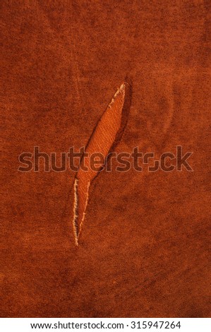 Brown, Orange Tan Leather Tear. Concept and Idea Style of Fine Leather Crafting, Handcrafts, Handmade, handcrafted, leather worker. Background Textured and Wallpaper. Vintage Rustic Style. Vertical.