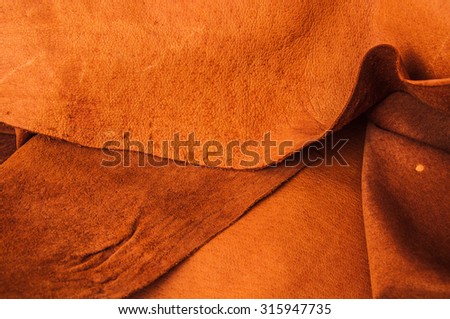 Brown, Orange Tan Leather. Concept and Idea Style of Fine Leather Crafting, Handcrafts, Handmade, handcrafted, leather worker. Background Textured and Wallpaper. Vintage Rustic Style.