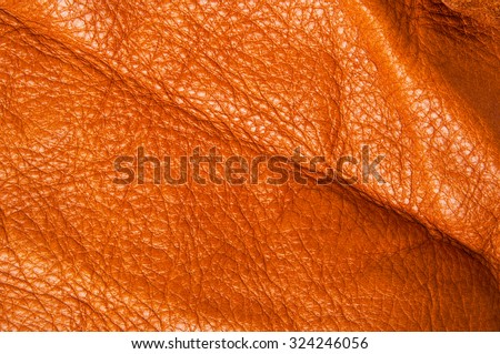 Leather. Tan, Brown, Orange. Concept and Idea of Fine Leather Crafting, Handcrafts Workspace, Handmade,Handcrafted and Leather Industry. Background Textured and Wallpaper.