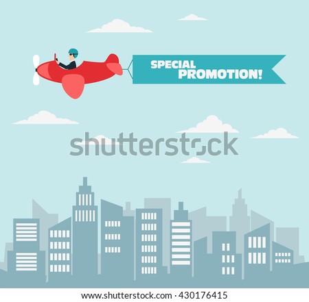 Businessman flying on airplane with banner over the city