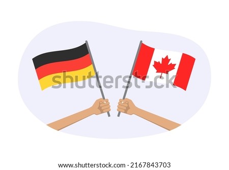 Germany and Canada flags. Canadian and German national symbols. Hand holding waving flag. Vector illustration.