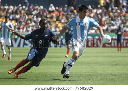 MONTERREY, MEXICO - JUNE 18: Maxi Padilla (R) escapes with the ball from Lenny Nangis (L) during FIFA U-17 World Cup Mexico 2011 on June 18, 2011 in Monterrey, Mexico. France won 3 - 0.