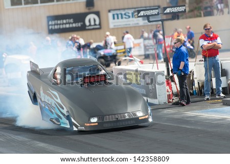 Morrison, CO - June 15, 2013: Jirka Kaplan Top Alcohol Funny Car does a burnout during Thunder on the Mountain presented by Grease Monkey at Bandimere Speedway.