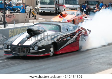 Morrison, CO - June 16, 2013: Car 532 Does a burnout during Thunder on the Mountain presented by Grease Monkey at Bandimere Speedway.