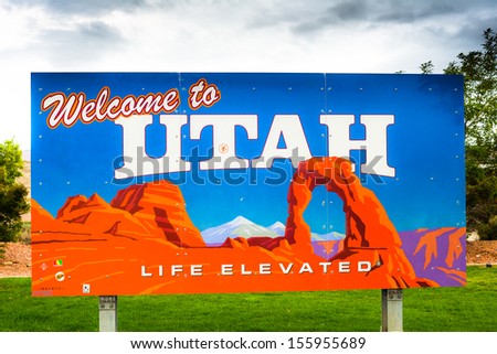 UTAH STATE LINE, UT - SEPTEMBER 14: A photograph of the Welcome to Utah sign at the visitor\'s center on the border of Colorado and Utah on September 14, 2013 in Utah.