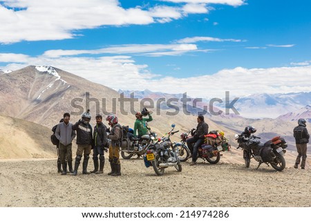 Tanglang La, India - July 22 2014: A group of bikers takes a break on the summit of the Tanglang La pass over 5300m  high in Ladakh in India