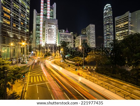 Cars rushing at night in Hong Kong business district around Admiralty