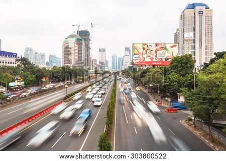 Jakarta, Indonesia - July 22 2015: Heavy traffic moves along Gatot Subroto road in the heart of Jakarta central business district in Indonesia capital city.